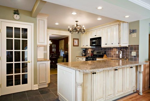 Giallo Napoli Granite Countertop with Antique Stained White Cabinets, Natural Slate Square Backsplash and Natural Slate Flooring Tile